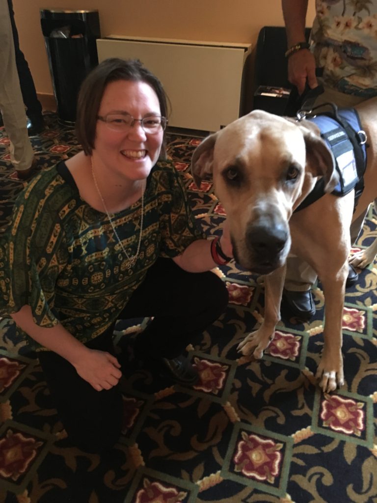 Erin Joy Swank with a Great Dane service animal in vest