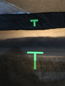 A T shaped marking on both a show scrim and dance floor, showing center