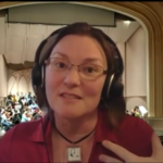 A woman with a headset microphone