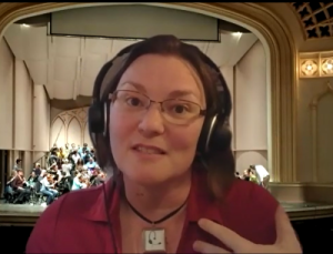 A woman with a headset microphone