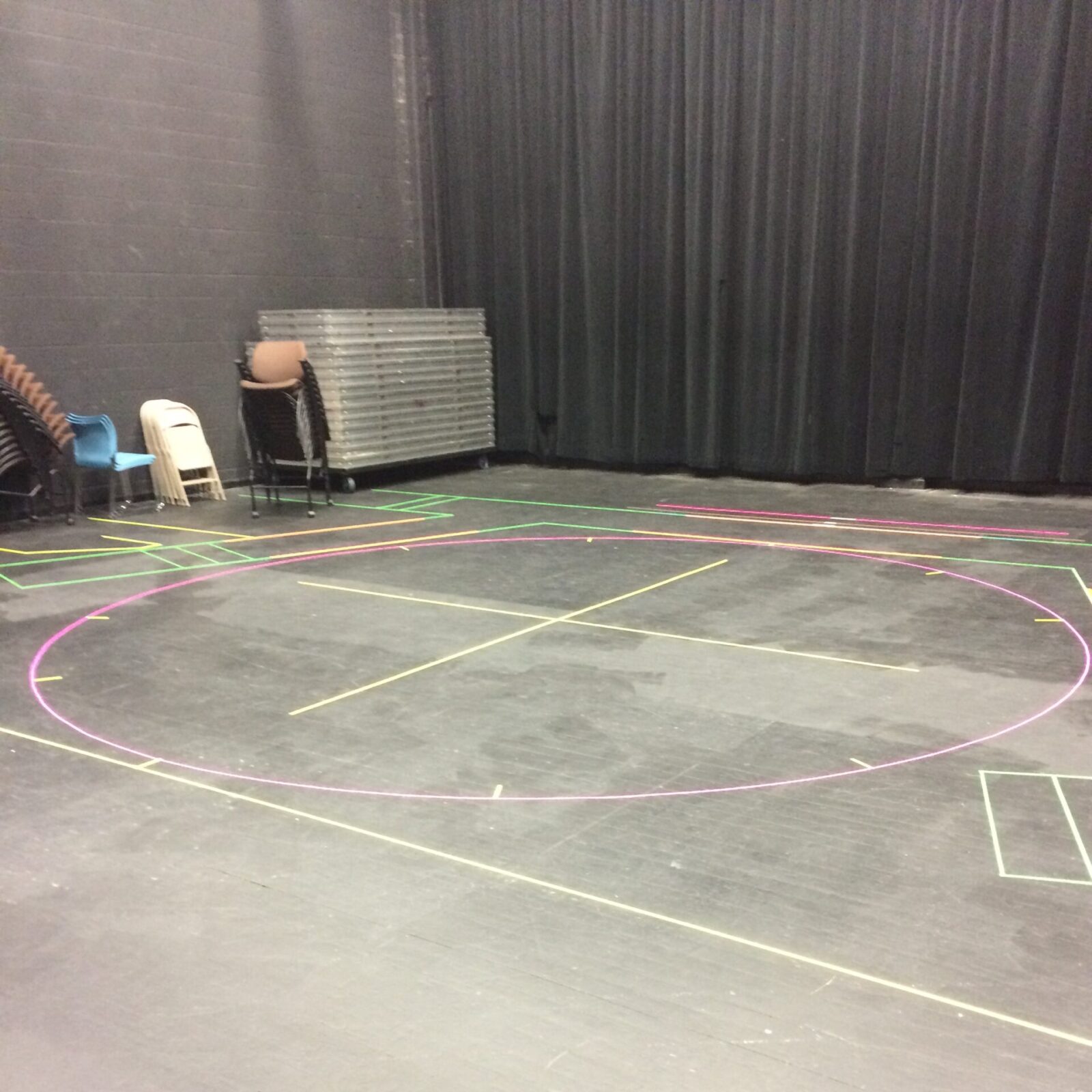 Photo of a completed groundplan of spike tape in a rehearsal hall