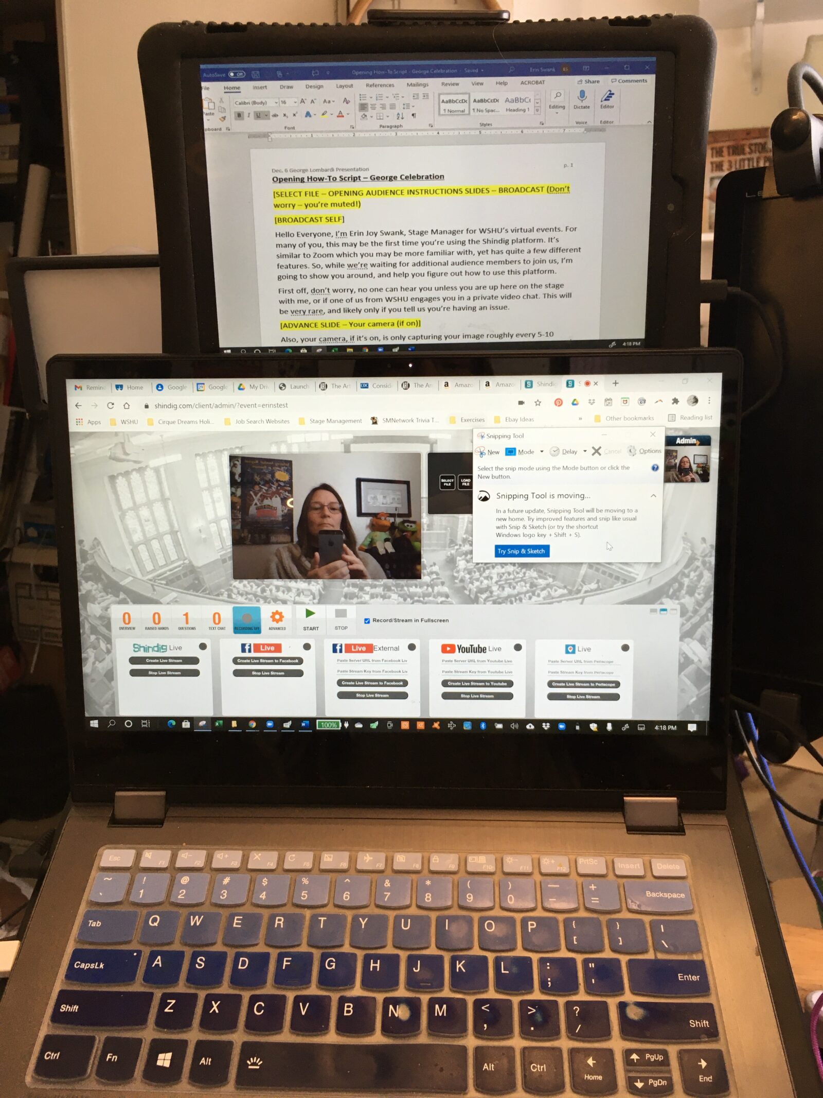 Image showing a tablet above a laptop screen