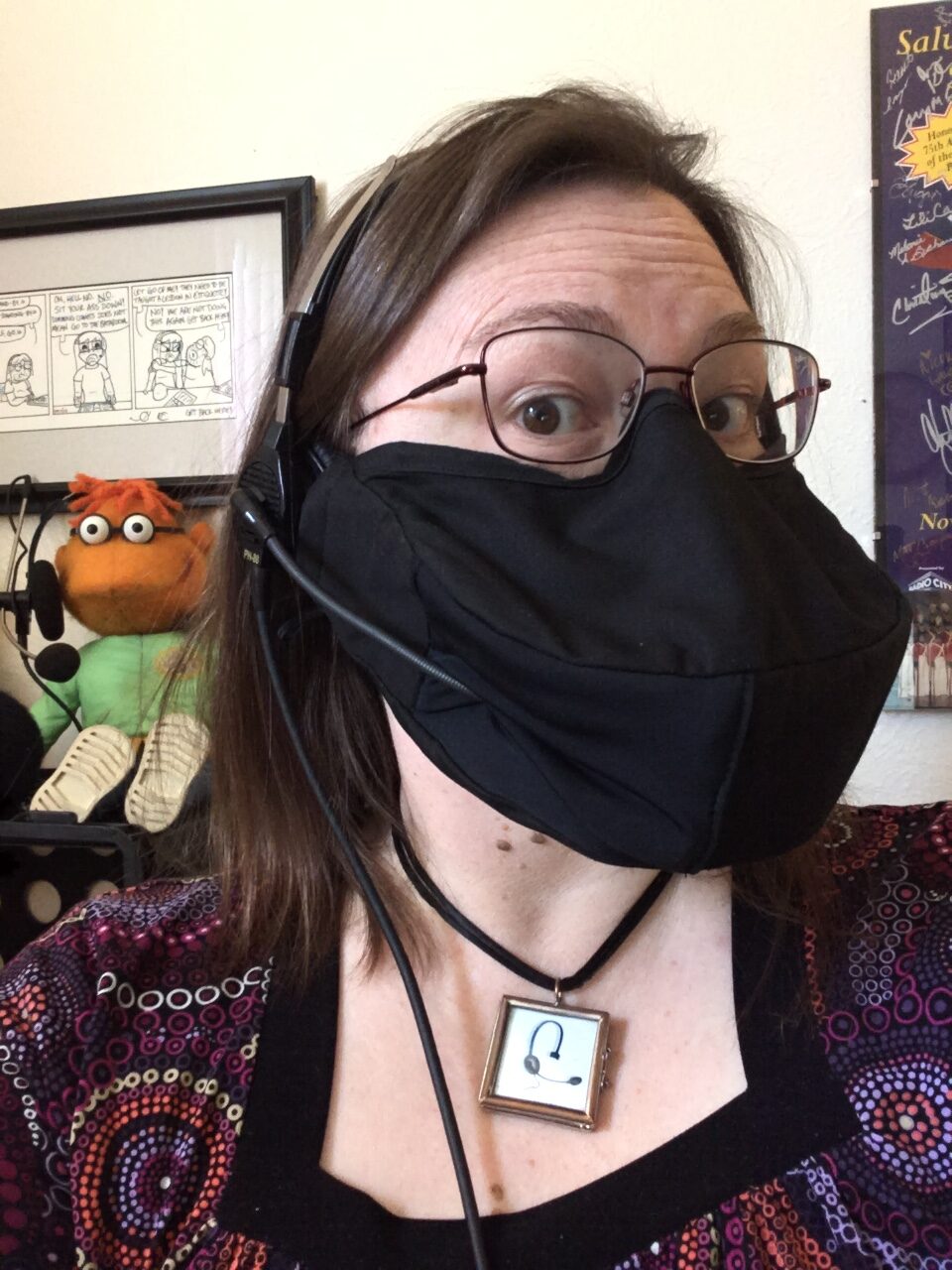 Stage Manager Erin Joy Swank wears a mask designed for headset use