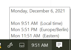 Screenshot of a PC computer clock from the bottom right corner, showing the date and time in local time, as well as Europe/Berlin and Eastern time zones